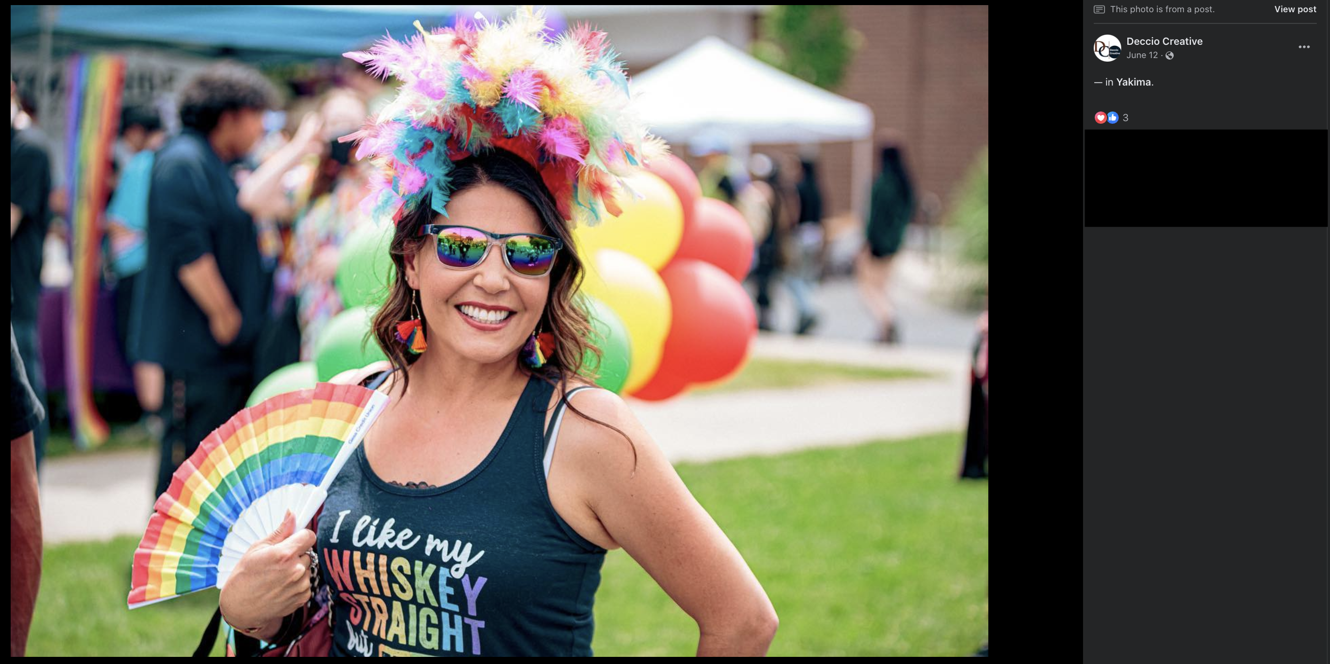 Woman in LGBTQ gear.